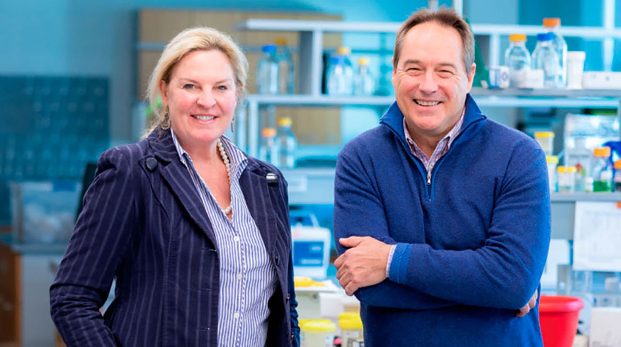 Two people smiling in lab