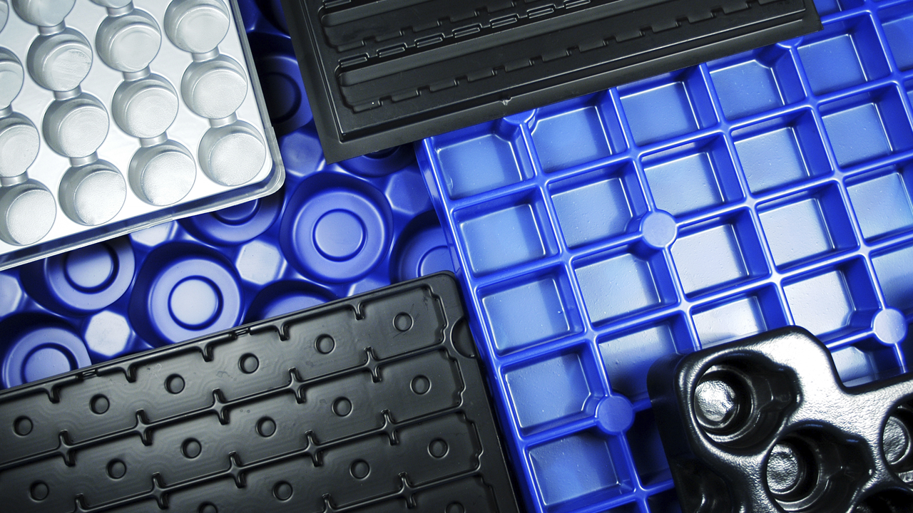 Plastic and metal trays with many compartments