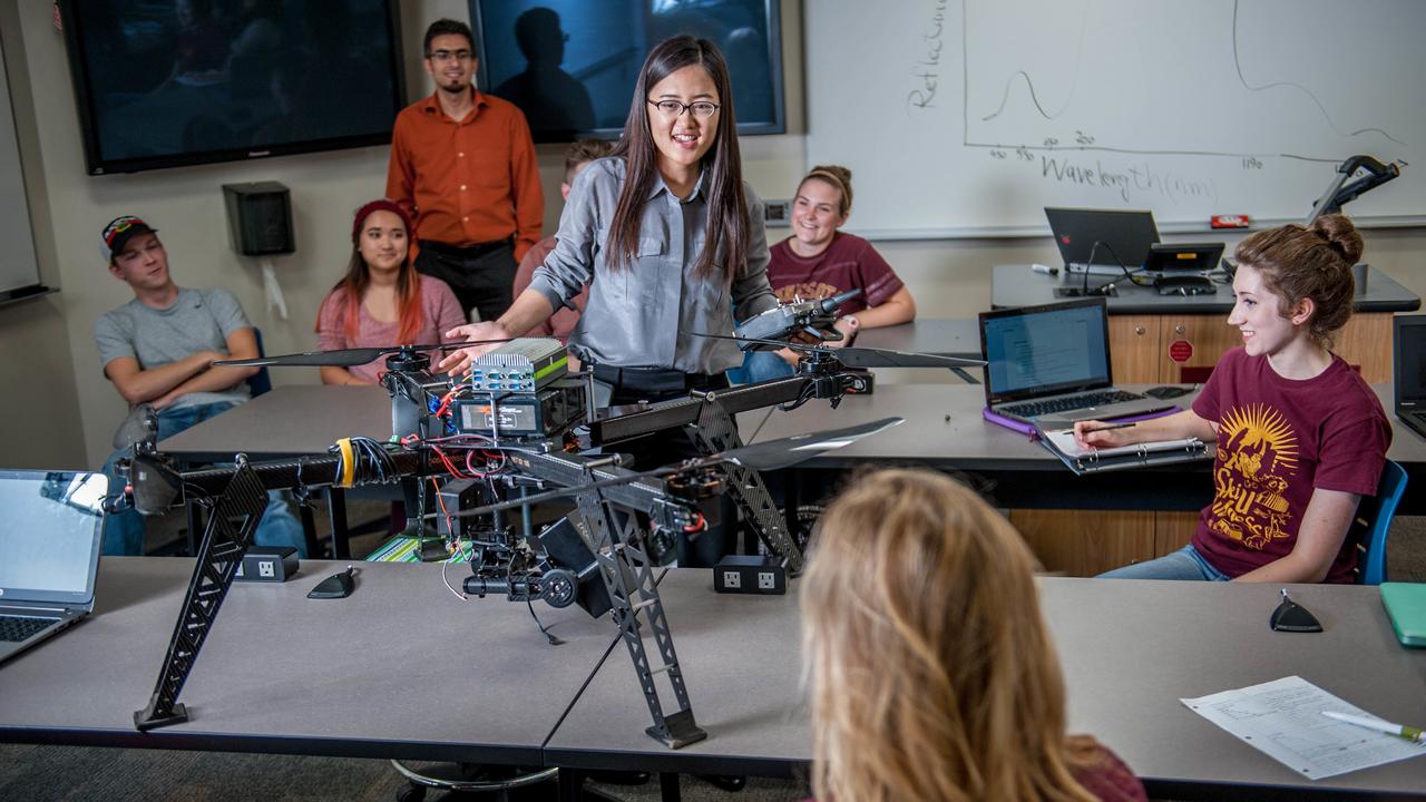 UMN Associate Professor Ce Yang displaying her agricultural drone to students
