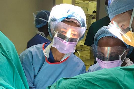 Dr. Nardos wearing PPE in OR with OBGYN faculty from botswana and urogyn fellow from OHSU