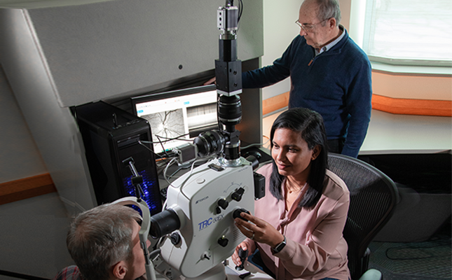 Researchers use camera to look at patient’s eye.