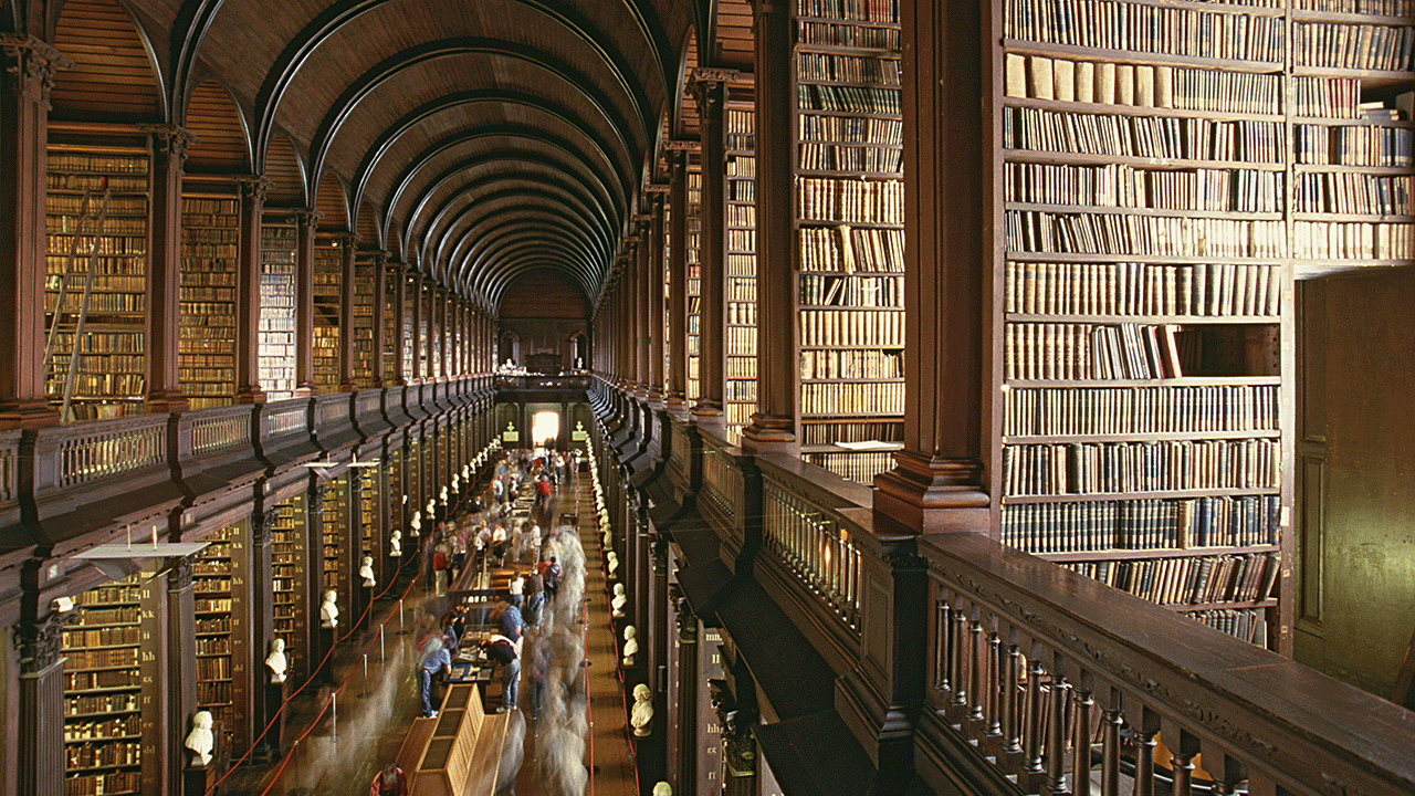 Books on countless shelves at the Library of Trinity College Dublin