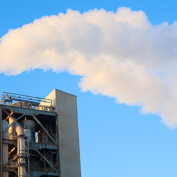 Emissions flow out of a cement plant