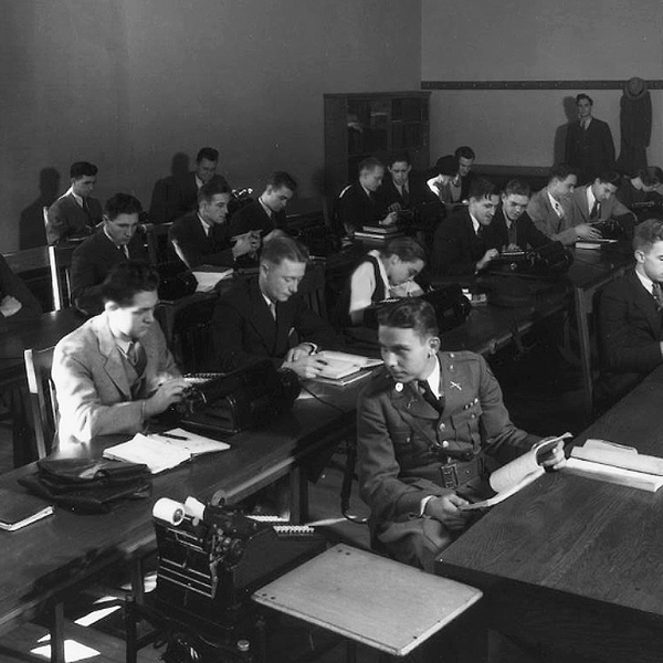 Students attend a business school class in the 1920s