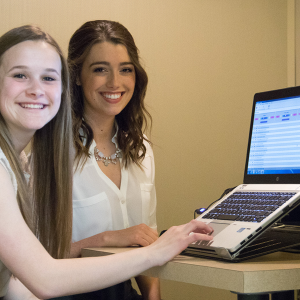 University of Minnesota Duluth students Jaclyn Friese and Claire Barnes use voice banking technology to record the voices of ALS patients for future use.